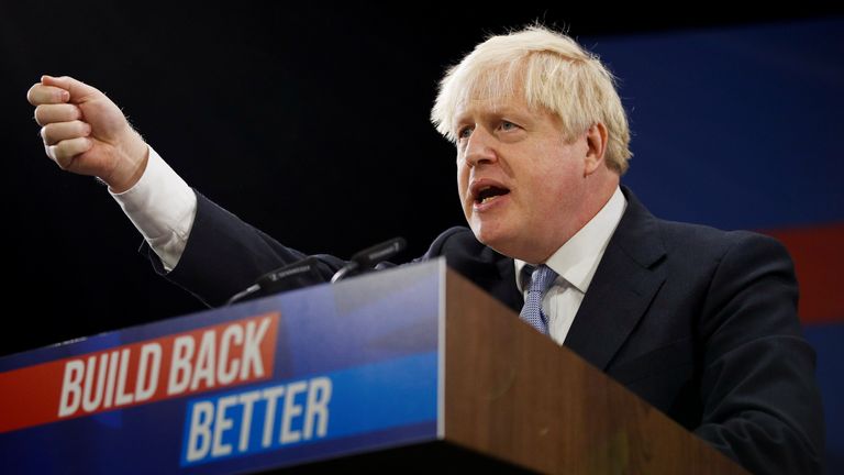 Britain's Prime Minister Boris Johnson gestures as he delivers a speech during the annual Conservative Party Conference, in Manchester, Britain, October 6, 2021. REUTERS/Phil Noble

