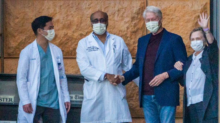 Former President Bill Clinton, and former first lady and former U.S. Secretary of State Hillary Clinton thank members of the medical staff as he is released from the University of California Irvine Medical Center in Orange, Calif., Sunday, Oct. 17, 2021. 