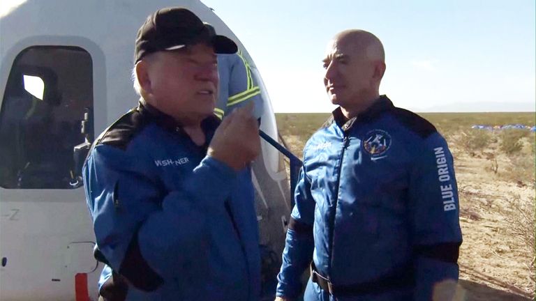 Jeff Bezos and William Shatner speak after the space flight