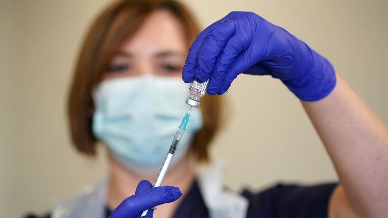 Nurse Heather Esmer draws a syringe before administering a Covid-19 vaccine booster at Birkenhead Medical Building in Birkenhead, Merseyside. Picture date: Saturday October 23, 2021.