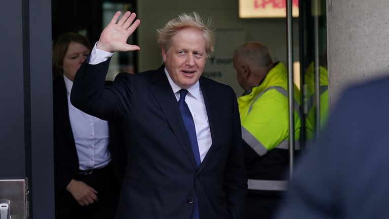 Boris Johnson waves as he leaves Media City in Salford, after appearing on the Andrew Marr Show