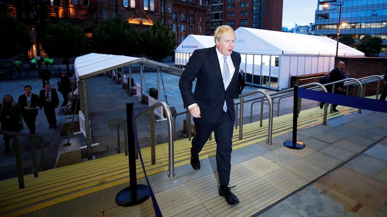 Britain&#39;s Prime Minister Boris Johnson walks to the conference venue ahead of the annual Conservative Party conference, in Manchester, Britain, October 5, 2021. REUTERS/Phil Noble
