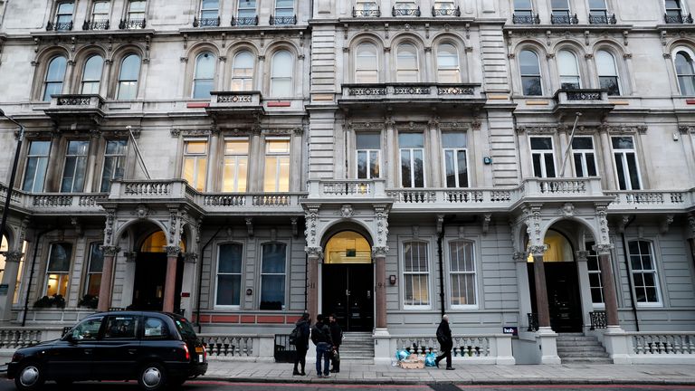 People stand outside the building housing the offices of Orbis Buiness Intelligence (C) where former British intelligence officer Christopher Steele works, in central London, Britain, January 12, 2016. REUTERS/Stefan Wermuth
