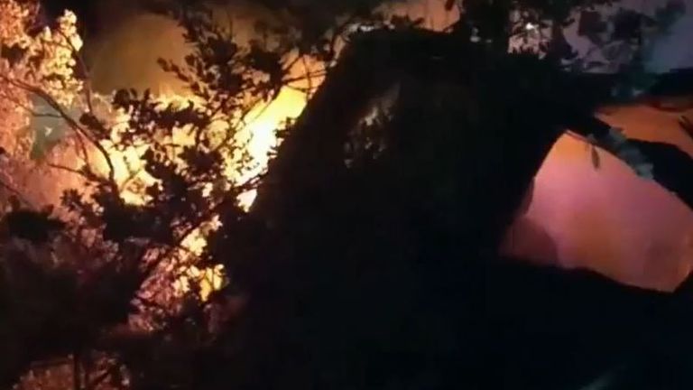 Police drag man from burning car in Texas