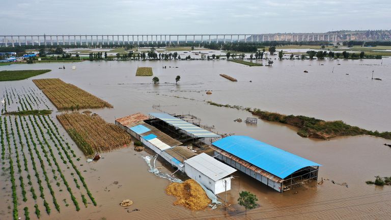In this photo released by Xinhua News Agency, an aerial photo shows an overflowing Yellow River near Lianbo Village in Hejin City in northern China's Shanxi Province on Sunday, Oct. 10, 2021
PIC:AP
