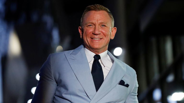 Actor Daniel Craig poses at the unveiling ceremony of his star on the Hollywood Walk of Fame in Los Angeles, California, U.S., October 6, 2021. REUTERS/Mario Anzuoni

