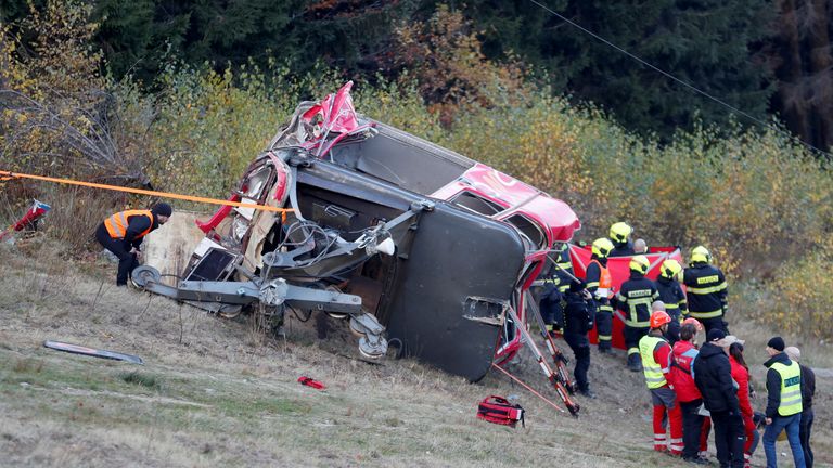 Police and rescue service members are seen near the crashed cable car in Liberec, Czech Republic