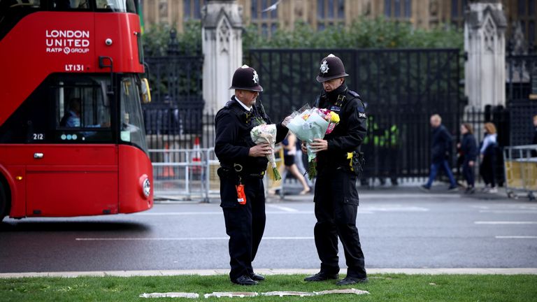 Police have moved the tributes left to the long-serving MP left outside the Houses of Parliament
