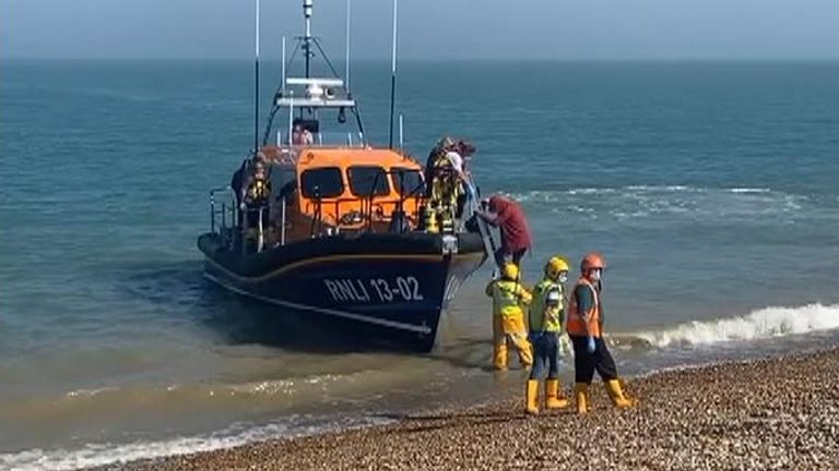 Migrants arrive on the beach at Dungeness