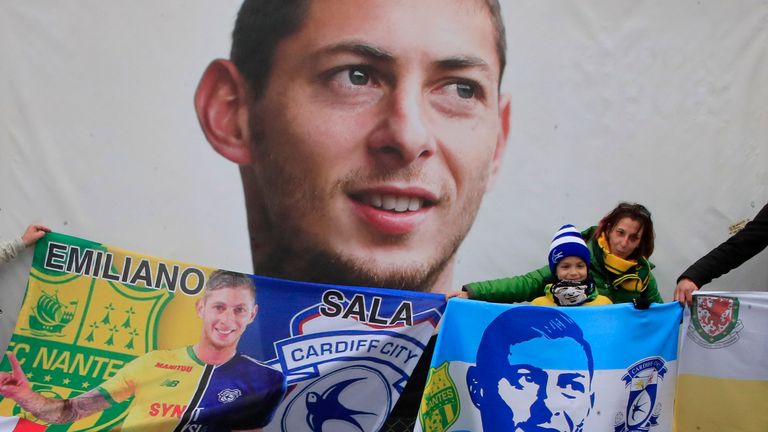 Cardiff supporters gather to pay tribute to Argentinian soccer player Emiliano Sala. Pic: AP