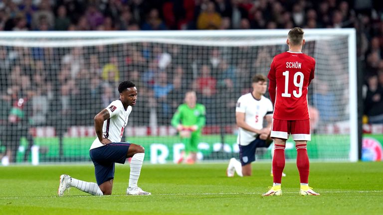 England&#39;s Raheem Sterling (left) takes a knee 