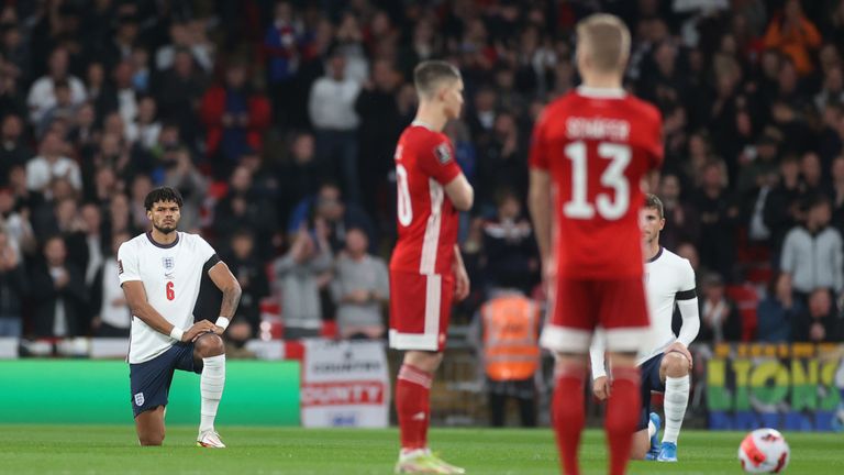 England players knelt before kick-off on Tuesday night, while Hungary&#39;s players remained standing