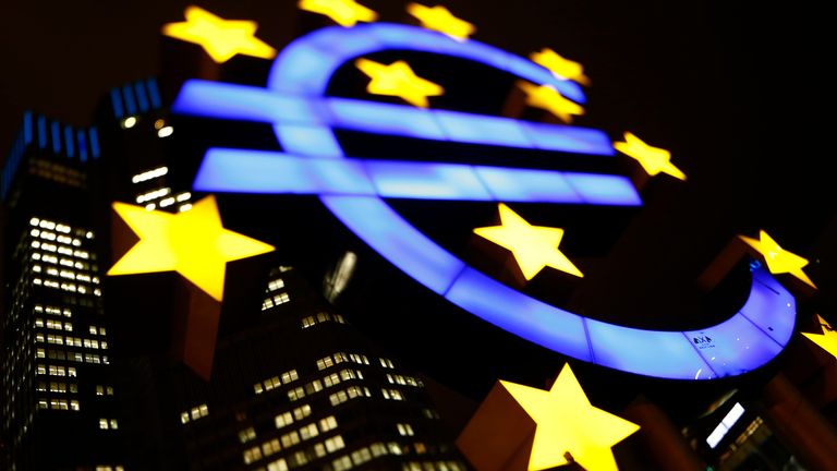 An illuminated euro sign is seen in front of the headquarters of the European Central Bank (ECB) in the late evening in Frankfurt January 8, 2013