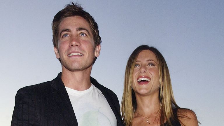 Jennifer Aniston (R) and Jake Gyllenhaal, cast members in the motion picture dark comedy "The Good Girl" pose during an industry screening of the film at the Pacific Design Center in the West Hollywood section of Los Angeles August 7, 2002. "The Good Girl" opens in Los Angeels and New York on August 7. REUTERS/Jim Ruymen JR
