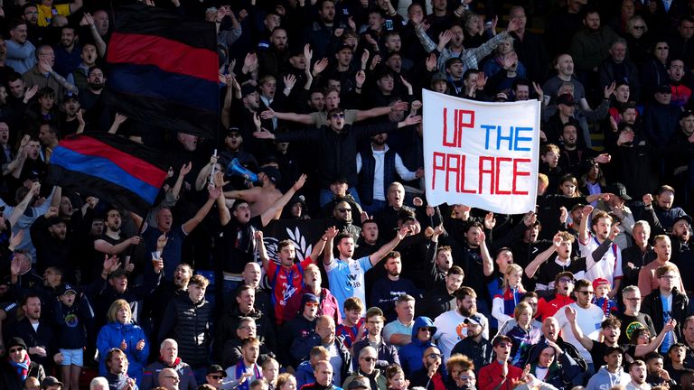 Crystal Palace fans cheer on their team during the Premier League match at Selhurst Park, London. Picture date: Sunday October 3, 2021.