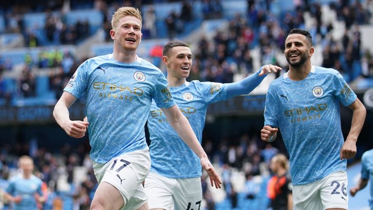 Soccer Football - Premier League - Manchester City v Everton - Etihad Stadium, Manchester, Britain - May 23, 2021 Manchester City&#39;s Kevin De Bruyne celebrates scoring their first goal with Riyad Mahrez and Phil Foden Pool via REUTERS/Dave Thompson 