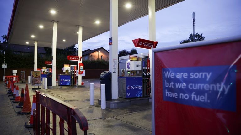 A sign informing customers that fuel has run out is pictured at an Esso fuel station in south London, Britain, October 5, 2021. REUTERS/Hannah McKay
