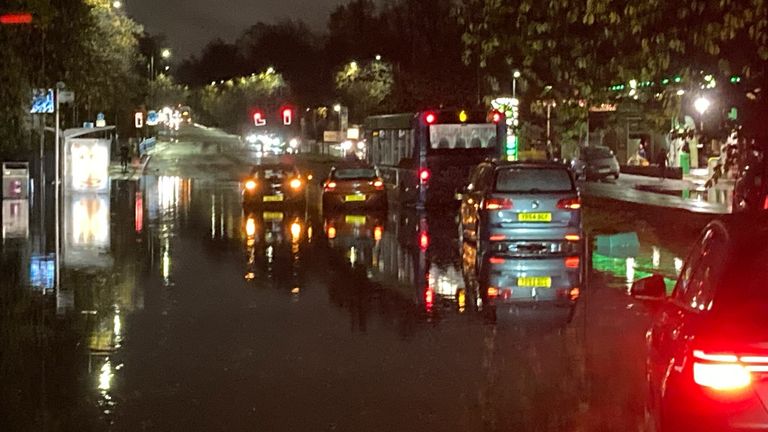 Cars driving along roads submerged in water in Glasgow. Pic: Prof Larissa Naylor