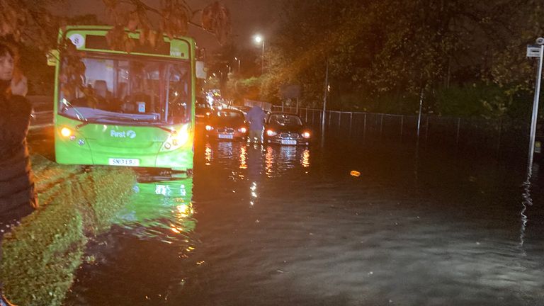 A bus perched on the side of a road as flood water sweeps through Glasgow. Pic: Prof Larissa Naylor