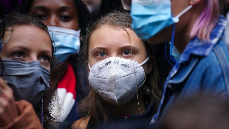 Teenage activist Greta Thunberg (centre) joins activists taking part in the Youth Strike to Defund Climate Chaos protest against the funding of fossil fuels outside Standard Chartered Bank in London. Picture date: Friday October 29, 2021.

