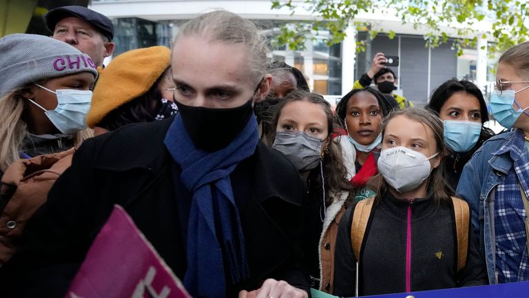 Climate activist Greta Thunberg, third right, arrives to demonstrate in front of the Standard and Chartered Bank during a climate protest in London, England, Friday, Oct. 29, 2021. People were protesting in London ahead of the 26th U.N. Climate Change Conference (COP26), which starts Sunday in Glasgow, Scotland. (AP Photo/Frank Augstein)
PIC:AP

