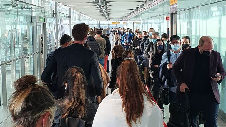 Passengers queue for the Arrival Hall at London Heathrow Airport&#39;s Terminal 5, due to a problem with the self-service passport gates. Picture date: Wednesday October 6, 2021.