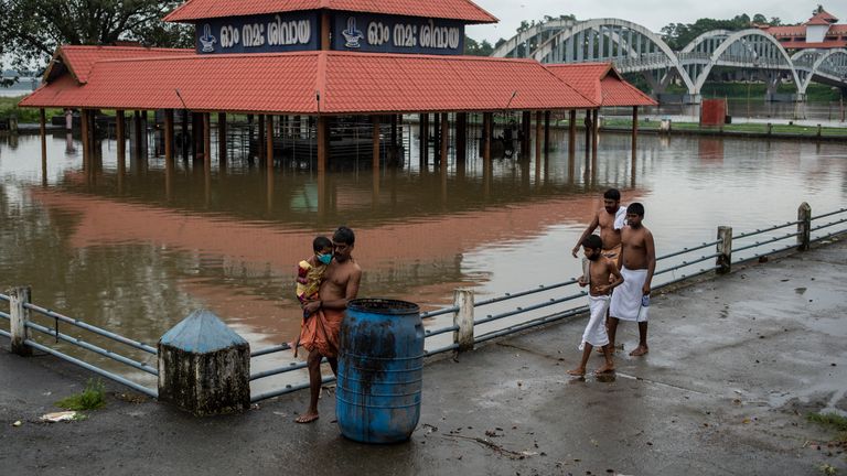 A Shiva temple on the banks of the Periyar River is surrounded by flood water following heavy rains in Kochi, Kerala. Pic: AP