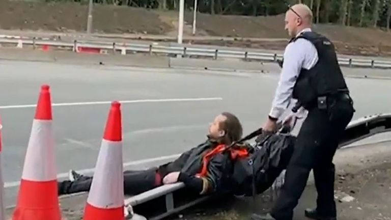 Insulate Britain protester is dragged off M25