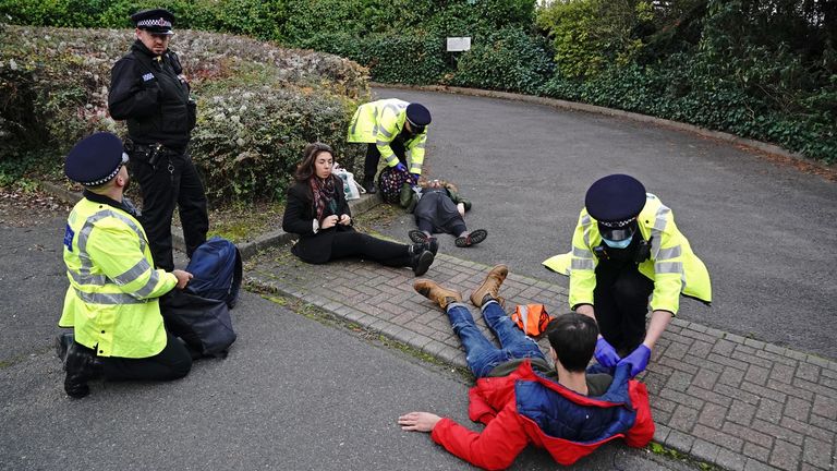 Protesters from Insulate Britain are arrested by police in the car park of the DoubleTree Hilton at Dartford Crossing. Picture date: Wednesday October 27, 2021.
