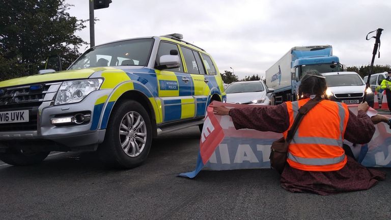 Handout photo issued by Insulate Britain of protesters from Insulate Britain blocking Junction 25 of the M25 motorway at Waltham Cross in Hertfordshire. Picture date: Friday October 8, 2021.
