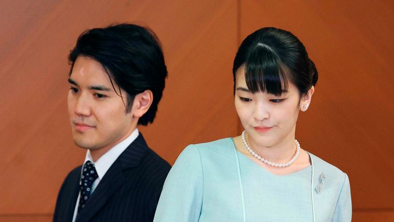 Former Japanese princess Mako and her husband Kei Komuro meet the press at a Tokyo hotel on Oct. 26, 2021. They got married earlier in the day, and the princess became Mako Komuro under a family registry with her husband. (Pool photo) (Kyodo via AP Images) ==Kyodo