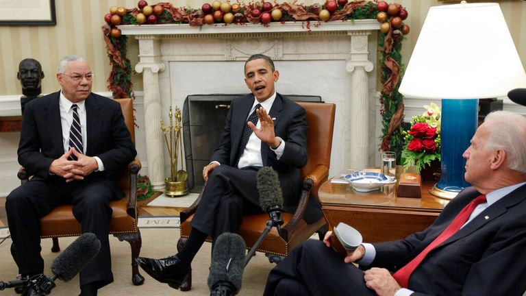 Former US president Barack Obama talks with reporters after his meeting with Colin Powell and former Vice President Joe Biden in 2010