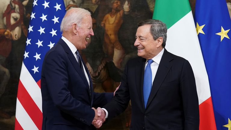 U.S. President Joe Biden and Italian Prime Minister Mario Draghi shake hands as they meet ahead of the G20 summit, in Rome, Italy October 29, 2021. REUTERS/Kevin Lamarque
