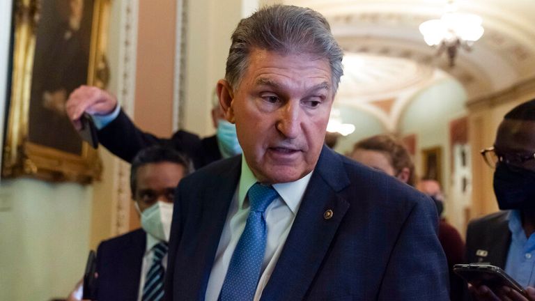 Sen. Joe Manchin, D-W.Va., speaks with reporters on Capitol Hill, Thursday, Oct. 7, 2021, in Washington. (AP Photo/Alex Brandon)