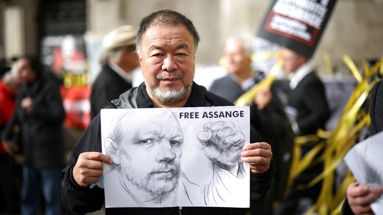 Chinese artist Ai Weiwei joins supporters of Wikileaks founder Julian Assange protesting outside the Royal Courts of Justice in London, Britain, October 27, 2021. REUTERS/Henry Nicholls
