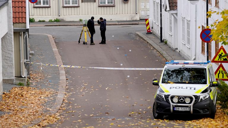 Members of the police work as the investigation continues after a deadly attack in Kongsberg