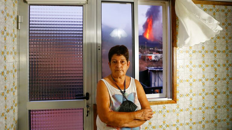 Maria Jesus of El Paso is one of the thousands of La Palma residents who can see the volcano from the window of her home