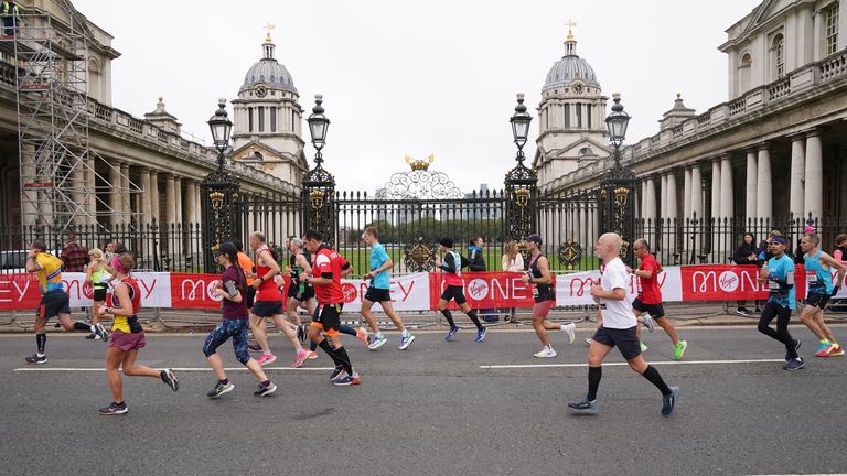 Runners pass the Old Naval College, Greenwich, during the Virgin Money London Marathon