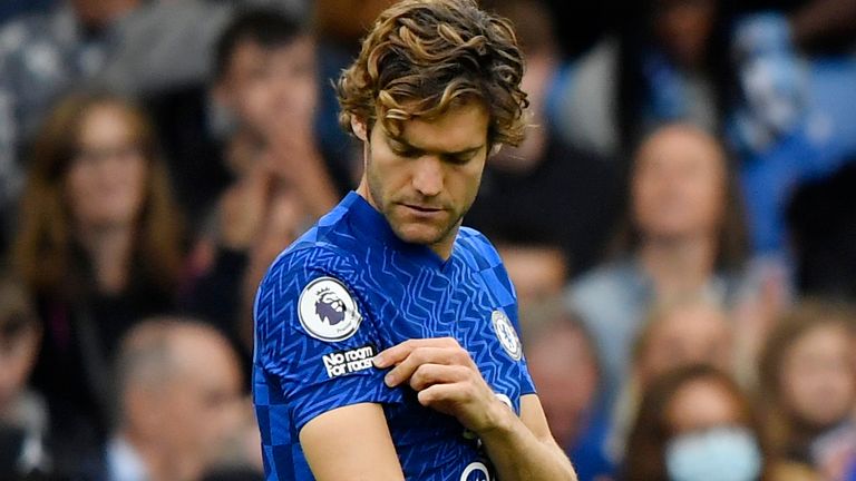 Chelsea&#39;s Marcos Alonso pointed to his &#39;no room for racism&#39; badge as other players took the knee