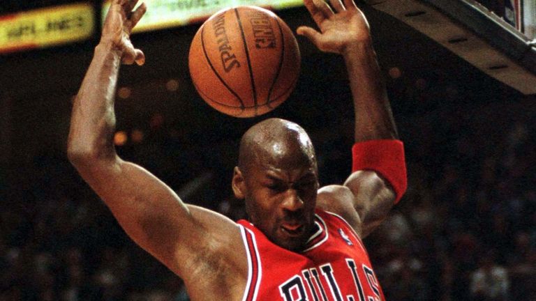 Jordan finishes a slam dunk for the Bulls in 1998