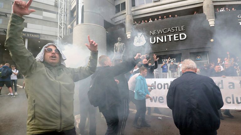 Newcastle United supporters celebrate in Newcastle Upon Tyne, England Thursday Oct. 7, 2021. English Premier League club Newcastle has been sold to Saudi Arabia’s sovereign wealth fund after a protracted takeover and legal fight involving concerns about piracy and rights abuses in the kingdom. (AP Photo/Scott Heppell)