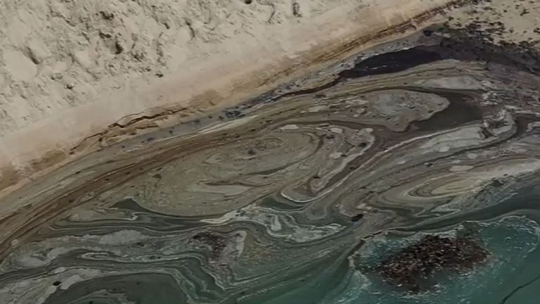 Oil spill washes up on beach in California