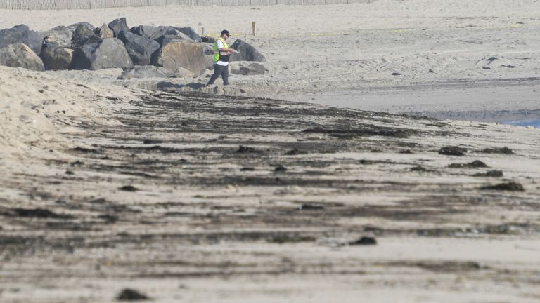 Oil stains are left behind on the State Beach that was closed down after a major oil spill off the coast of California has come ashore in Huntington Beach, California, U.S. October 3, 2021. REUTERS/Gene Blevins 