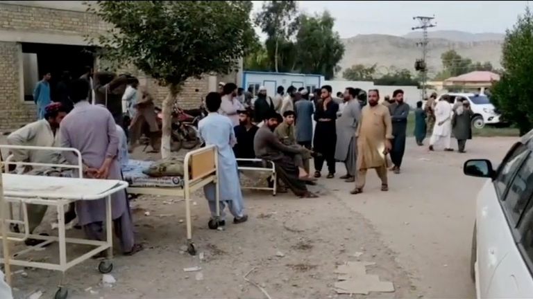 People gather outside a hospital following an earthquake in Harnai, Balochistan, Pakistan, October 7, 2021, in this still image obtained from video. Courtesy of QuettaVoice.com / Social Media via REUTERS ATTENTION EDITORS - THIS IMAGE HAS BEEN SUPPLIED BY A THIRD PARTY. NO RESALES. NO ARCHIVE. MANDATORY CREDIT QUETTAVOICE.COM.
