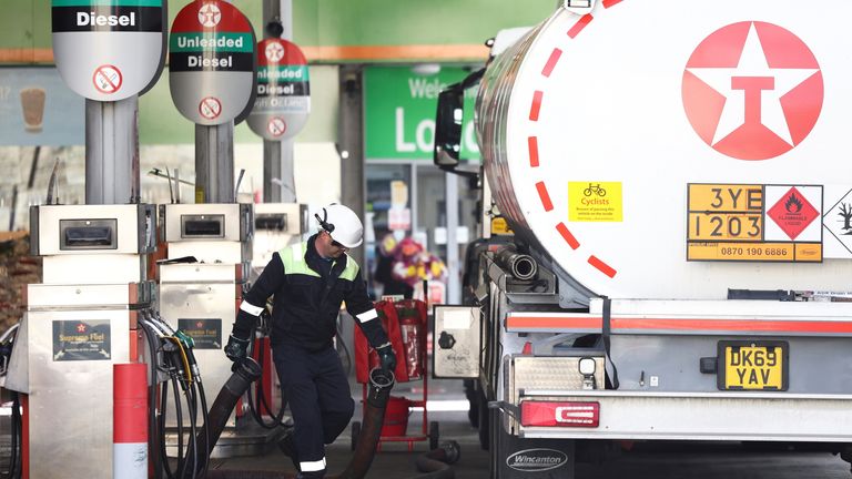 A tanker driver delivers fuel to a Texaco petrol station in London, Britain, October 4, 2021. REUTERS/Henry Nicholls
