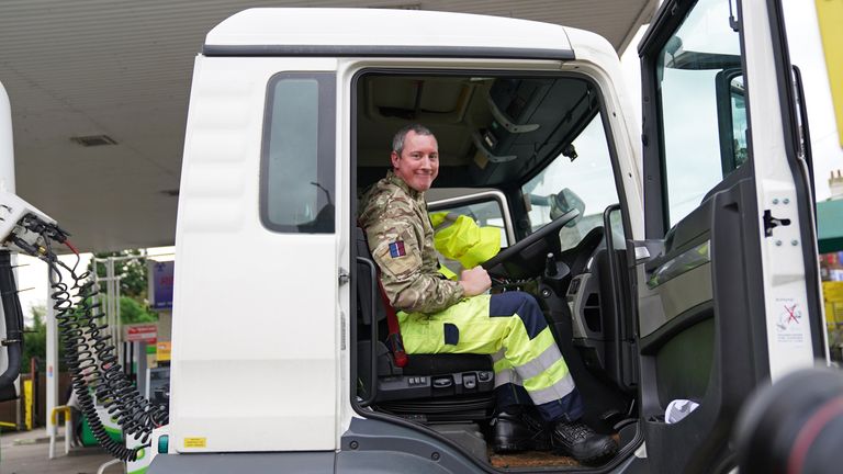 A member of the armed forces sits in the cab of a tanker after helping to deliver fuel to a garage in Waltham Abbey, Essex. Picture date: Tuesday October 5, 2021.