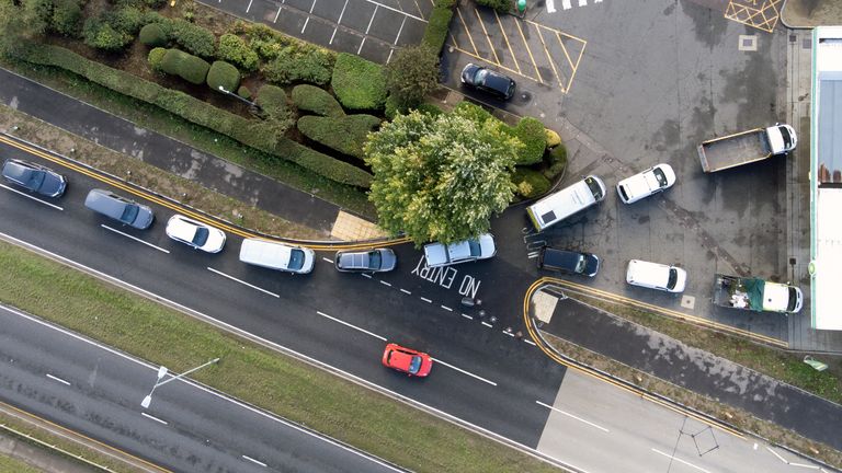 People line up for fuel at a gas station in Hemel Hempstead.  Photo date: Monday, October 4, 2021.