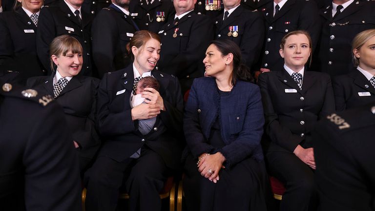 12/10/2021. London, United Kingdom. The Home Secretary, Priti Patel reacts as she speaks with Holly Necchi and her baby Autumn as she sits with nominees for the Police Bravery Award at a reception held within Number 10 Downing Street. Picture by Tim Hammond / No 10 Downing Street

