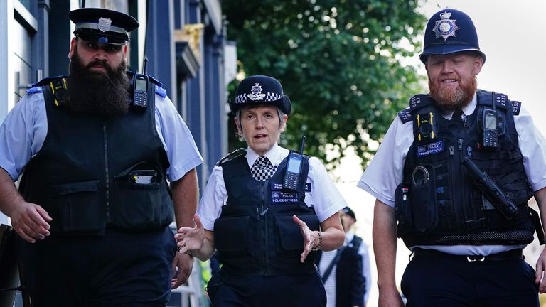 Metropolitan Police Commissioner Dame Cressida Dick alongside police officers during a walkabout in Westminster, London. Picture date: Monday October 4, 2021.