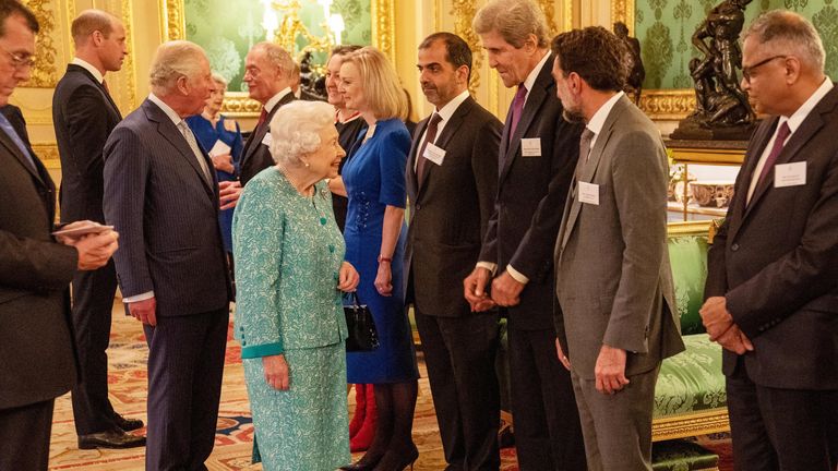 Britain&#39;s Queen Elizabeth greets U.S. climate adviser John Kerry at a reception for the Global Investment Summit in Windsor Castle, Windsor, Britain, October 19, 2021. Arthur Edwards/Pool via REUTERS